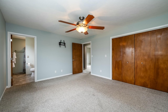 unfurnished bedroom with light carpet, ensuite bath, a closet, and ceiling fan