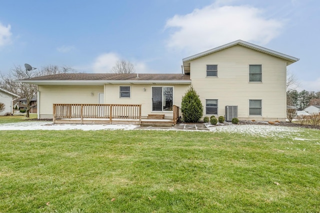 back of house with a wooden deck and a lawn