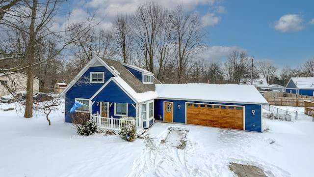 view of front of house featuring a porch and a garage