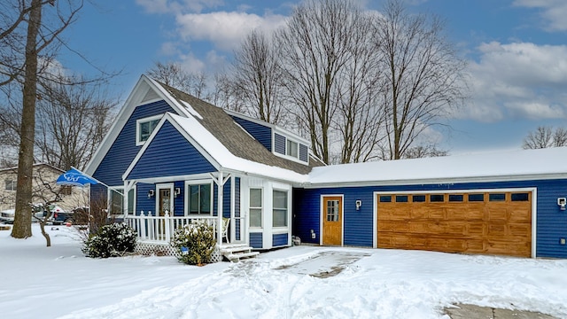 view of front of house with a garage and covered porch