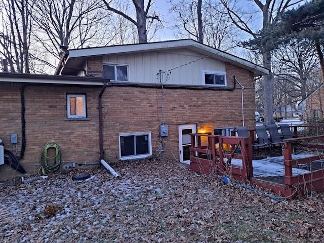 back of house featuring a deck