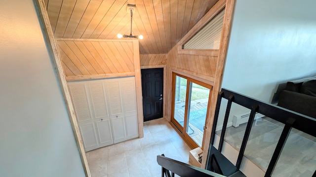 foyer entrance with light tile patterned floors, an inviting chandelier, wood ceiling, vaulted ceiling, and wooden walls