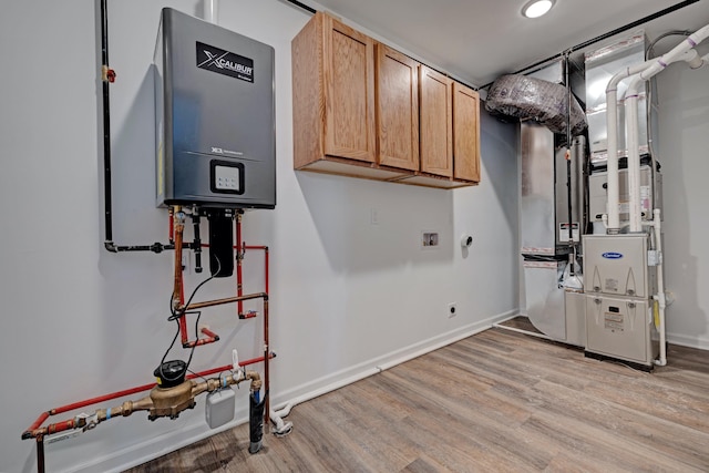 utility room featuring tankless water heater