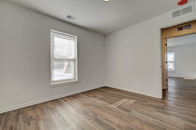 empty room featuring dark hardwood / wood-style floors