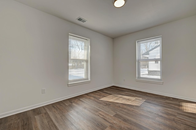 empty room featuring dark hardwood / wood-style floors