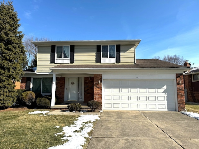 front of property with a garage and a front yard