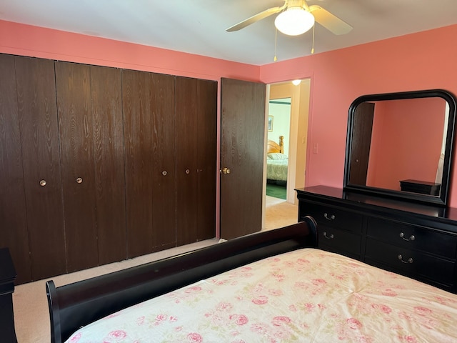 bedroom featuring ceiling fan and a closet