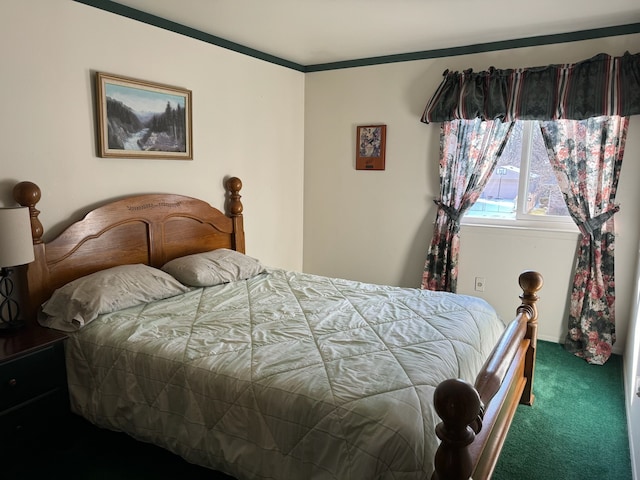 bedroom featuring ornamental molding and carpet floors