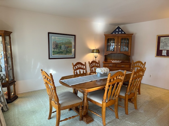 dining space featuring carpet