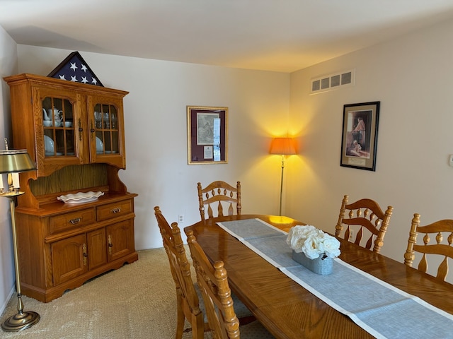 view of carpeted dining area