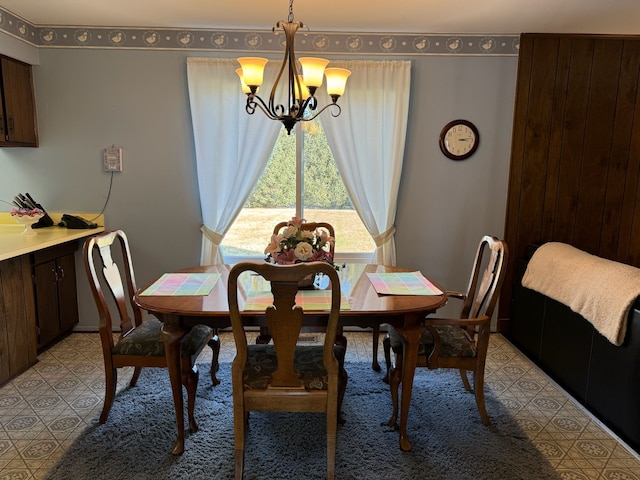 dining space featuring a notable chandelier