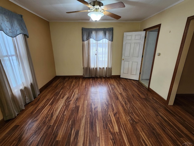 unfurnished bedroom featuring crown molding, dark wood-type flooring, and ceiling fan