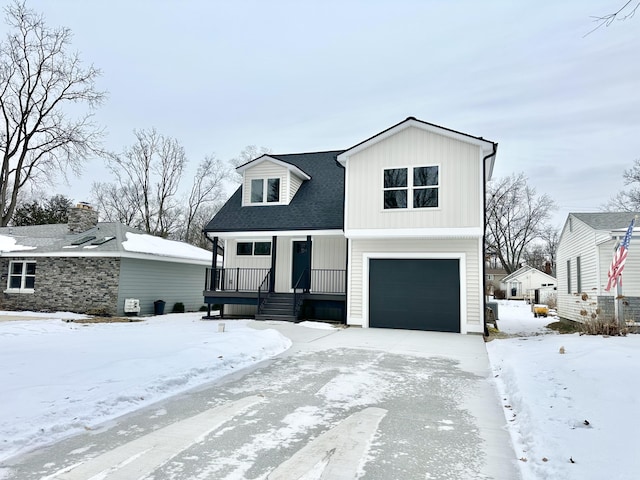 view of front of home with a porch and a garage