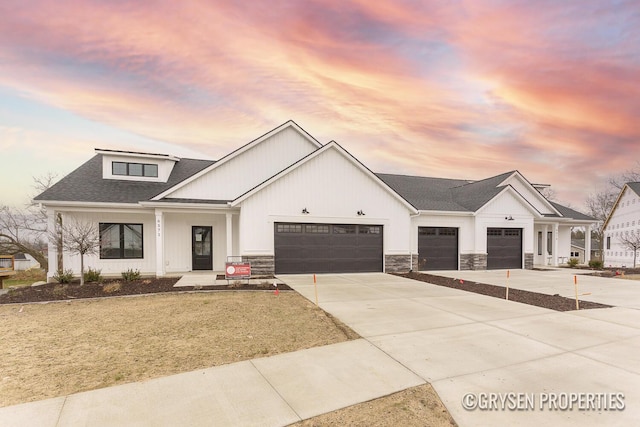 modern inspired farmhouse featuring a garage