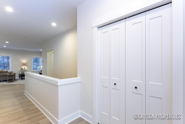 hallway with light wood-type flooring