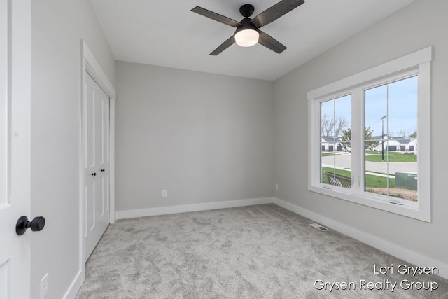 unfurnished bedroom with carpet floors, baseboards, and a closet