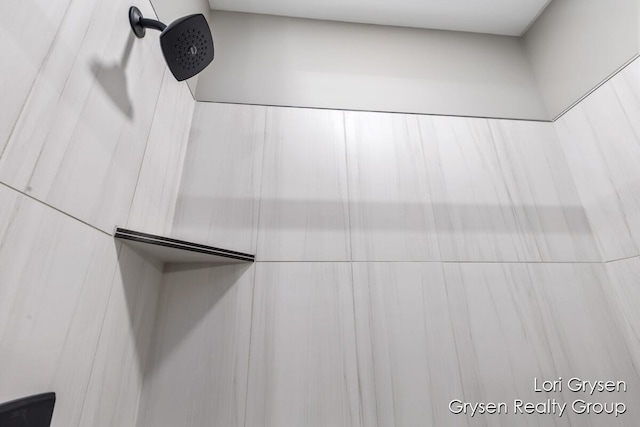 room details with a tile shower