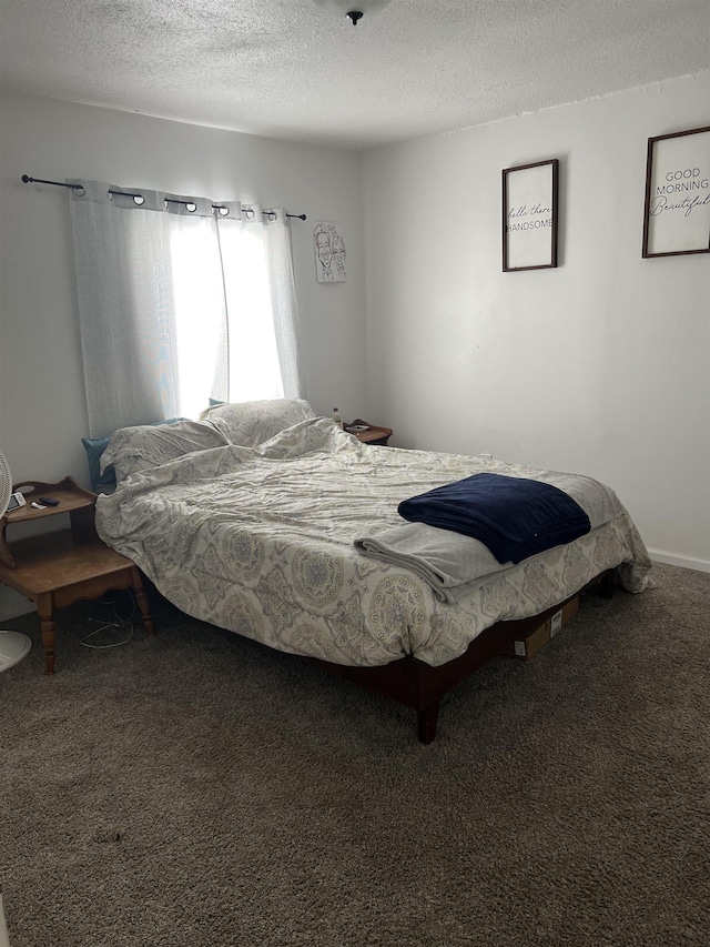 carpeted bedroom with a textured ceiling