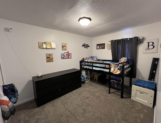 carpeted bedroom with a textured ceiling