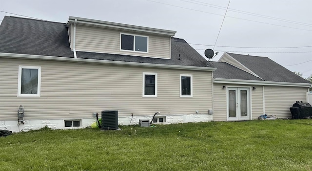 8017 S Saginaw St, New Lothrop, MI 48460 - rear view of property featuring central AC unit, a yard, and a shingled roof