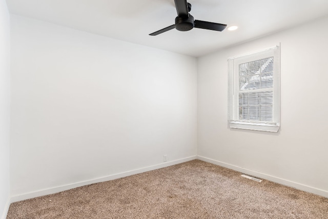 carpeted empty room with ceiling fan