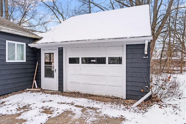 view of snow covered garage