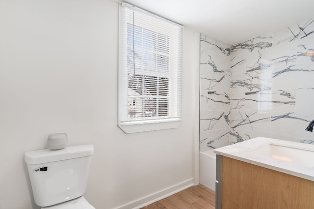 full bathroom with washtub / shower combination, vanity, toilet, and wood-type flooring