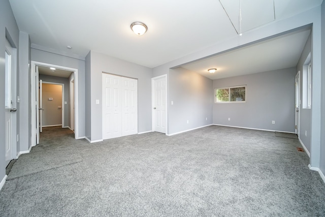 unfurnished bedroom with a closet and carpet