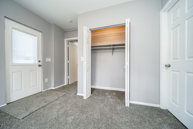 unfurnished bedroom featuring a closet and carpet