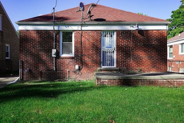 back of house with a yard