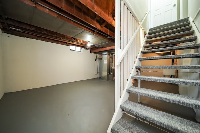 stairs with concrete flooring and heating unit