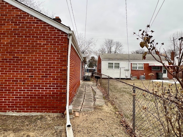 view of side of property featuring central AC unit