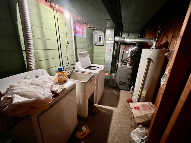 interior space featuring electric panel, gas water heater, and washer and clothes dryer