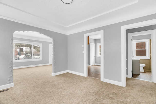 empty room with light colored carpet