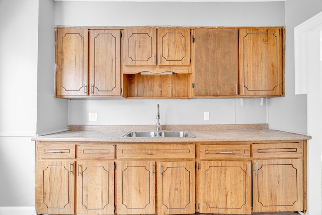 kitchen with sink and light brown cabinetry