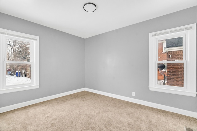 unfurnished room with carpet flooring