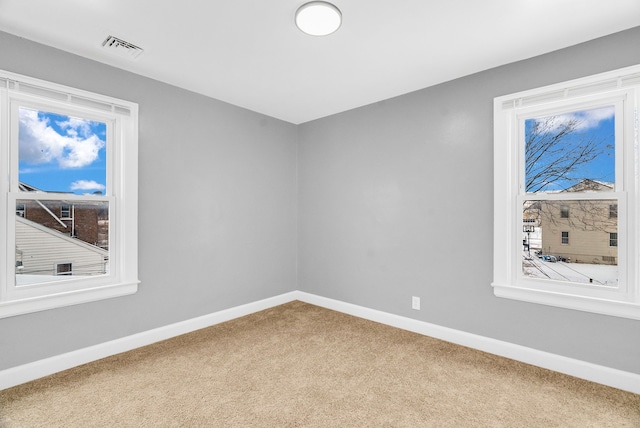 unfurnished room featuring carpet flooring