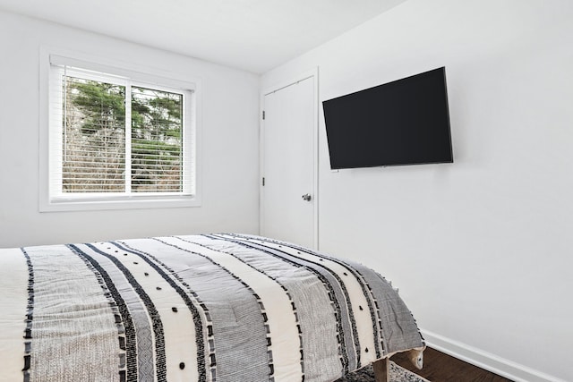 unfurnished bedroom featuring hardwood / wood-style flooring