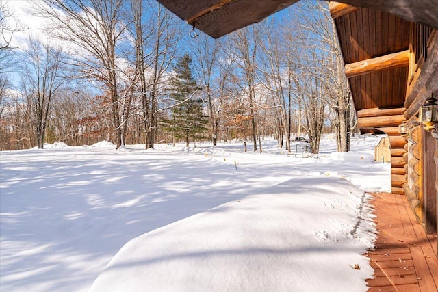 view of yard covered in snow