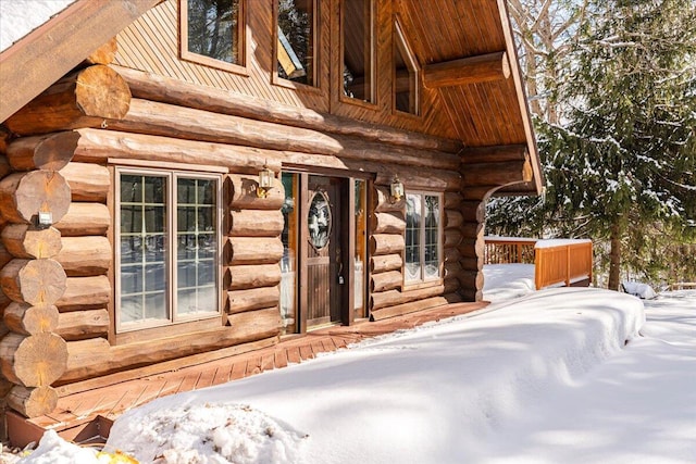 view of snow covered property entrance