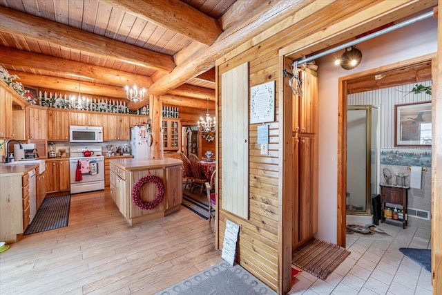 kitchen featuring decorative light fixtures, beamed ceiling, a notable chandelier, wood ceiling, and white appliances