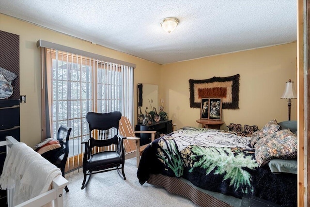 carpeted bedroom with a textured ceiling