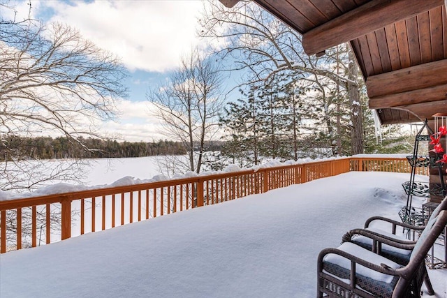 view of snow covered deck