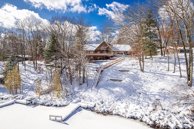 view of yard layered in snow