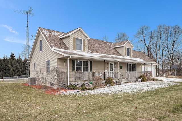 cape cod house featuring cooling unit, a garage, a front yard, and a porch