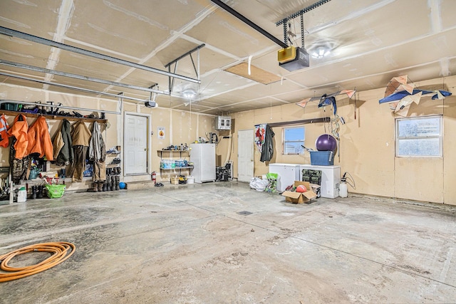 garage featuring a garage door opener, a wall mounted air conditioner, and white refrigerator