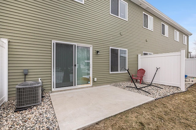 back of property with a patio and cooling unit