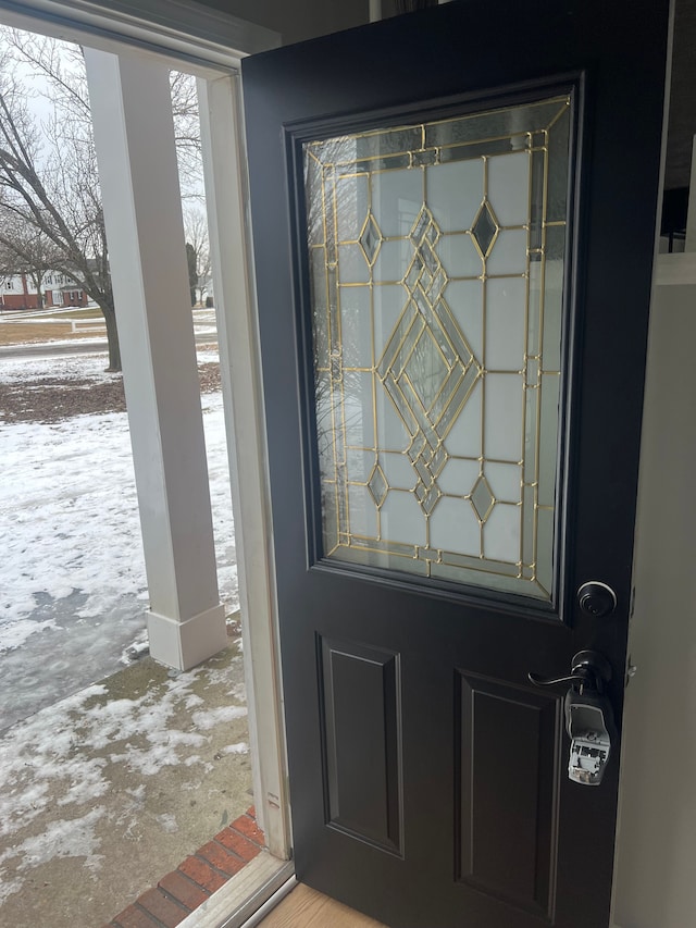 view of snow covered property entrance