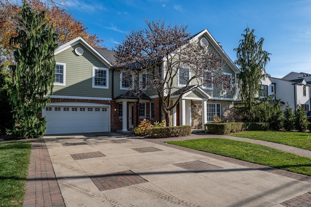 view of front of home with a garage and a front yard