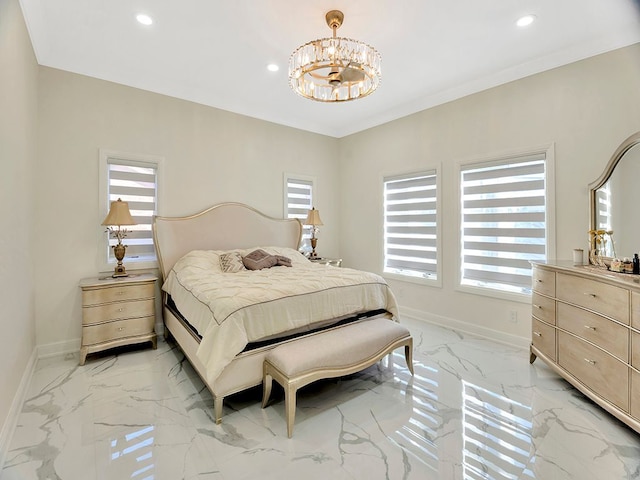 bedroom with multiple windows, crown molding, and a chandelier